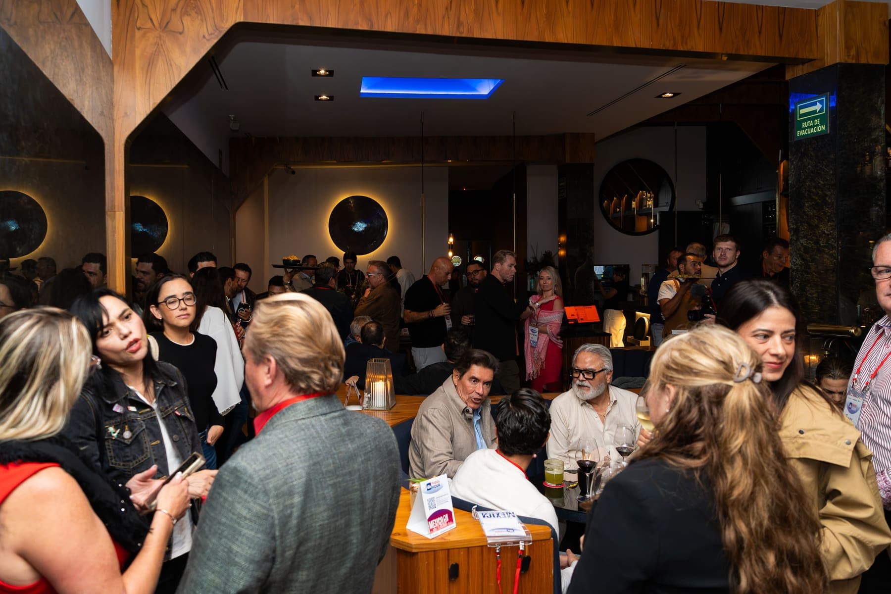 The main room at LicorerÃa Limantour Polanco full of guests at the Mexico City AI Happy Hour