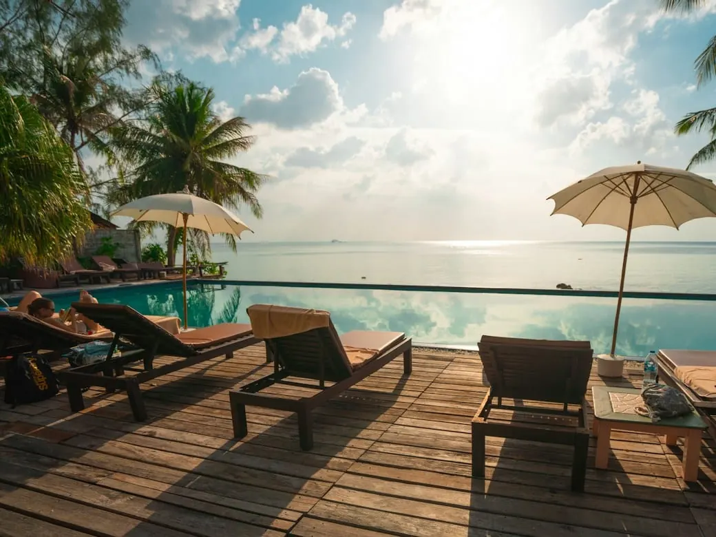 A resort pool deck at sunset